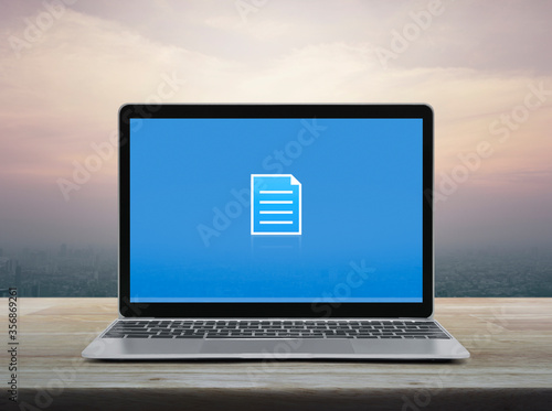 Document flat icon with modern laptop computer on wooden table over office city tower and skyscraper at sunset sky, vintage style, Technology communication online concept