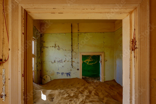 Sand has invaded and taken over these rooms in Kolmanskoppe, Namibia photo