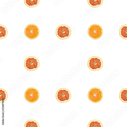 Seamless pattern of isolated slices of grapefruit and orange.