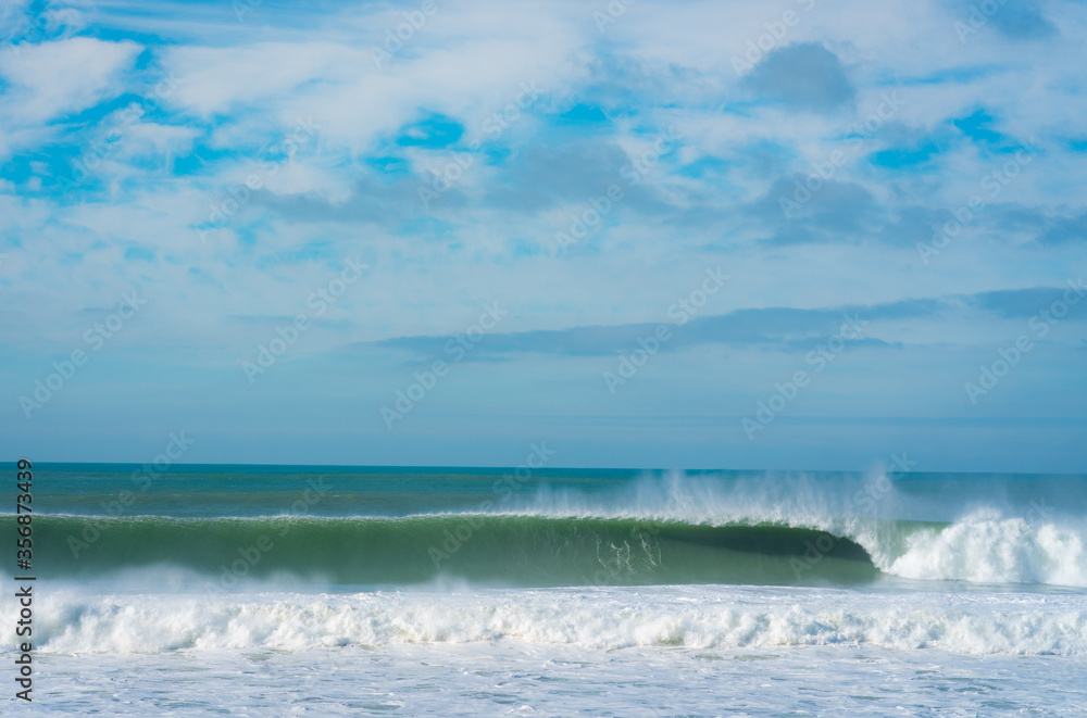 Perfect Swell at the California coast, wave crashing forming a tube 