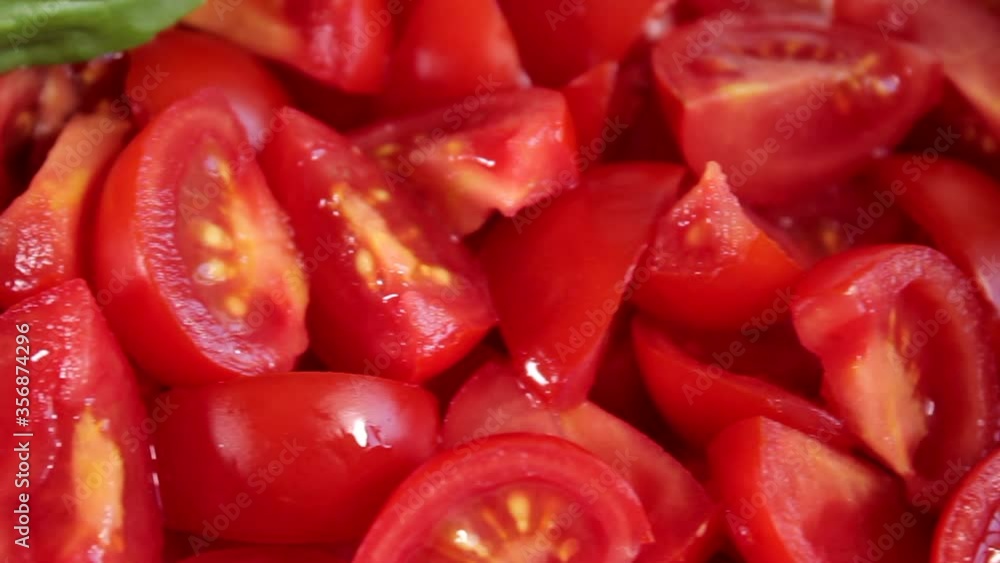 Raw sliced tomatoes and basil. Healthy vegetarian vegan organic food close up. Slider shot Raw sliced tomatoes and basil. Healthy vegetarian vegan organic food close up. Slider shot