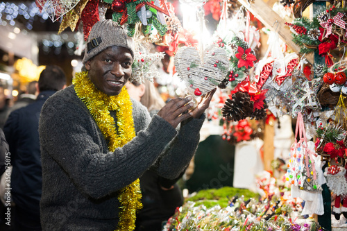 Man selecting festive Christmas decoration