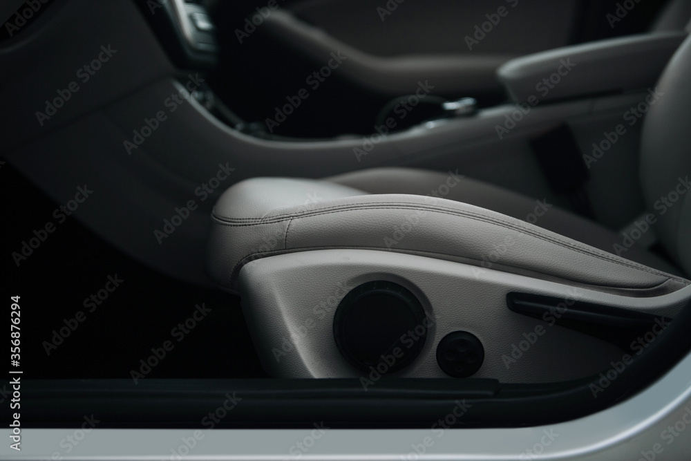 Modern car leather seat with adjustment close up