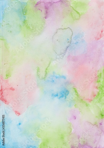 Colorful watercolor wash background with splashes of blue, green, purple and red