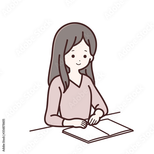 ノートをみている長袖服の女性
