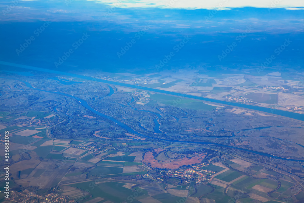 Aerial view of Danube river and water canals, airplane flight over Slovakia 