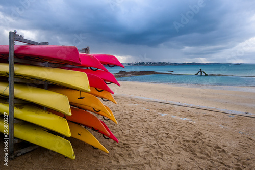 colorful kayaks on the beach of Saint Malo, Brittany, France