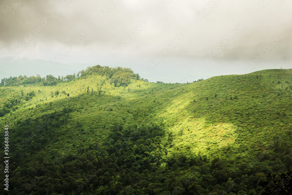 Green mountain peak top view with cloud sky shadow background landscape Green mountain peak top view with cloud sky shadow background landscape