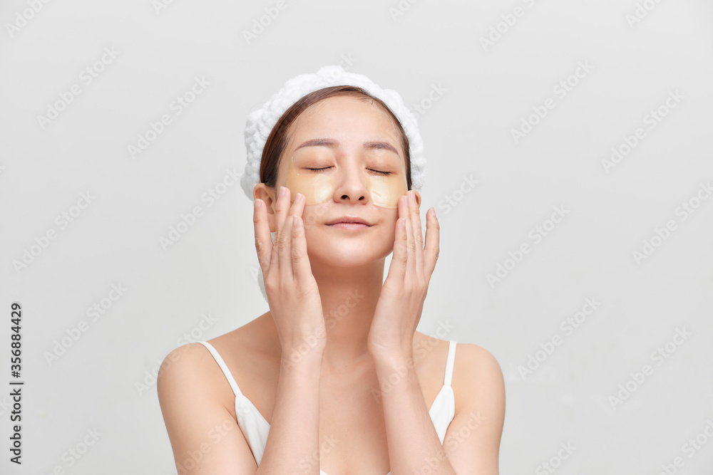Beautiful Happy Spa Girl Isolated on a White Background.Touching her Face Beautiful Happy Spa Girl Isolated on a White Background.Touching her Face
