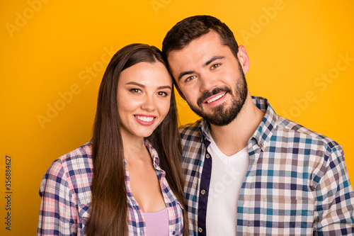 Close up photo of positive spouses sweethearts enjoy spend summer rest relax together wear plaid clothes isolated over bright color background