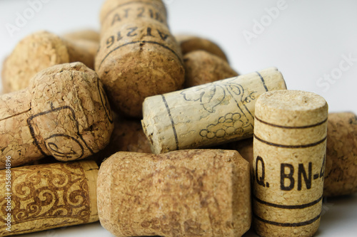 
a large number of wine corks on a white background