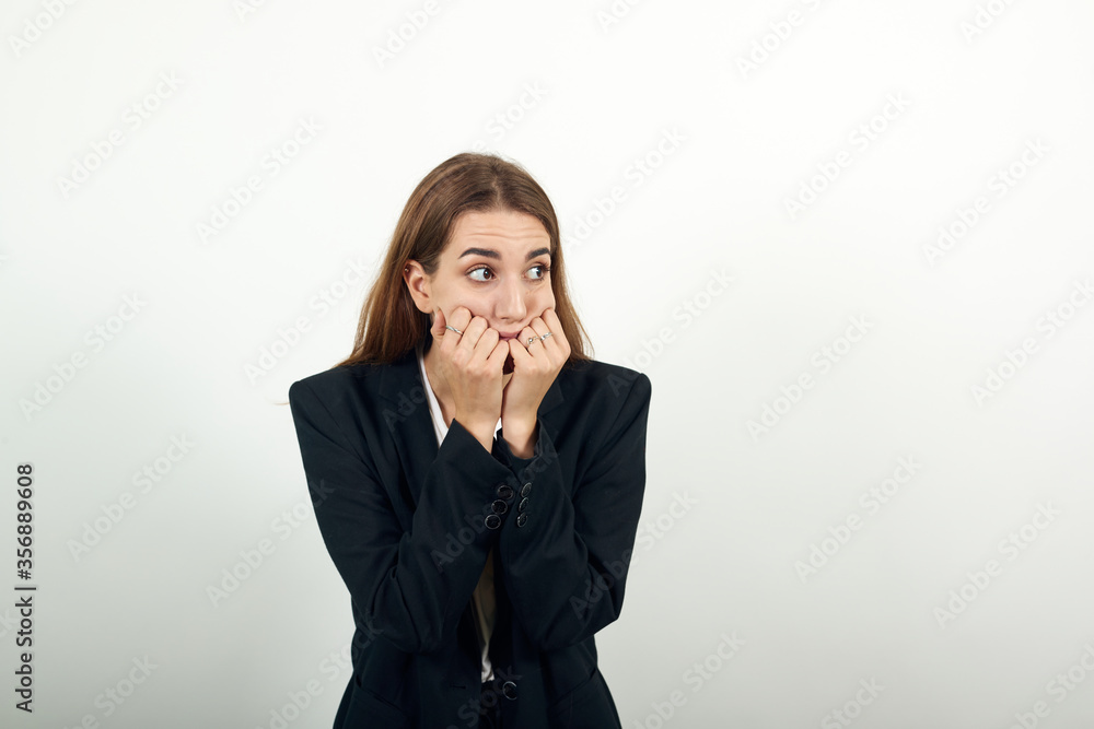 Image of scared, biting fists emotionally. Covering mouth behind knuckle . Having fear. Nervous frightened keeps hand near face, worried expression, stares at camera. Anxious unshaven feels depressed. Image of scared, biting fists emotionally. Covering mouth behind knuckle . Having fear. Nervous frightened keeps hand near face, worried expression, stares at camera. Anxious unshaven feels depressed.
