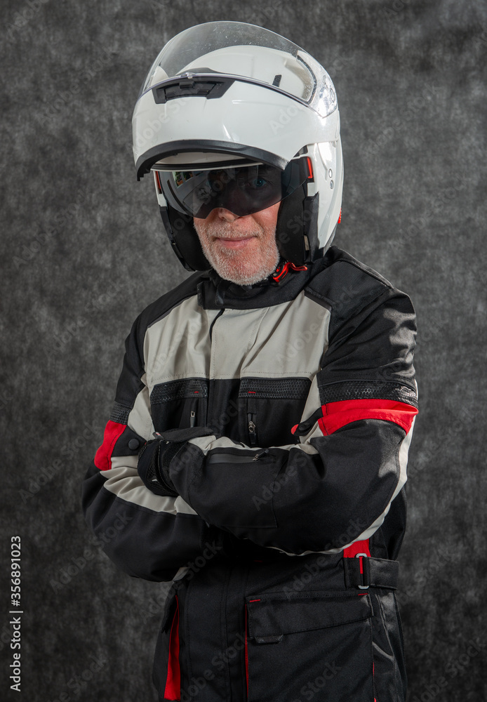 portrait of senior biker with white helmet portrait of senior biker with white helmet