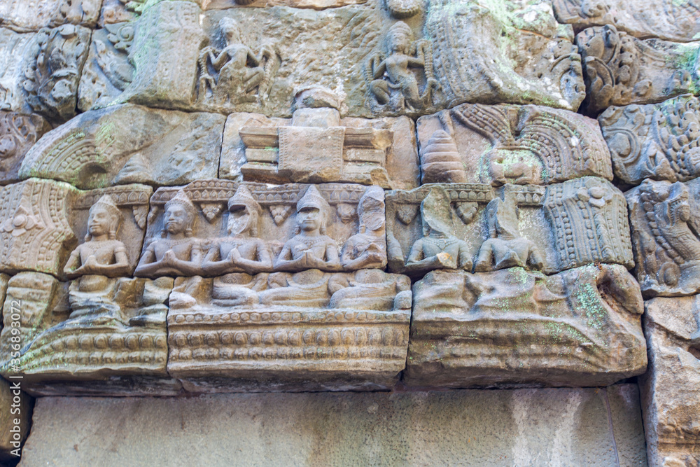 Apsara and Ta Prohm temple ruins, Angkor Wat complex, Siem Reap, Cambodia.