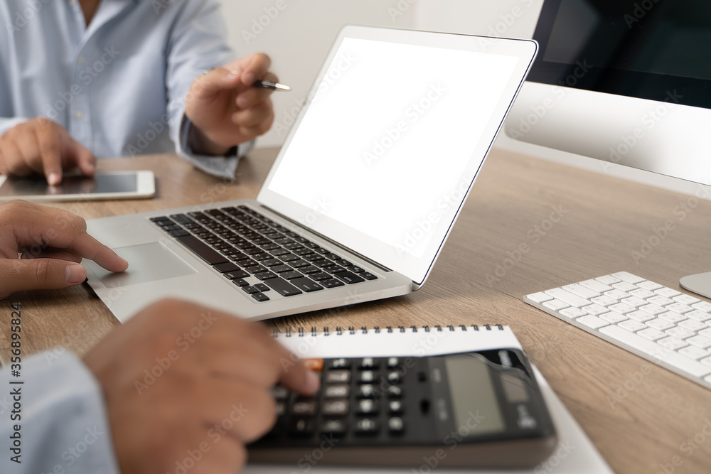 young man working Businessman using a desktop computer of the blank screen young man working Businessman using a desktop computer of the blank screen