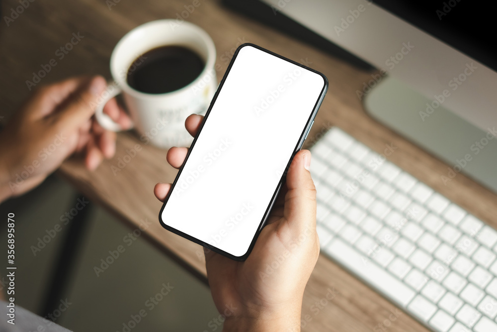 Top view Mockup image hand using a smartphone man Holding Cell Phone With Blank Screen Top view Mockup image hand using a smartphone man Holding Cell Phone With Blank Screen