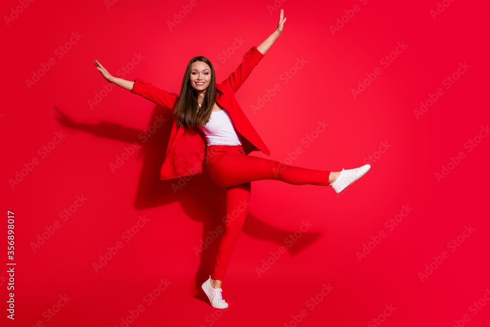 Full body profile photo of attractive funny business lady success worker walk home street vacation having fun wear office blazer suit pants white shoes isolated bright red color background Full body profile photo of attractive funny business lady success worker walk home street vacation having fun wear office blazer suit pants white shoes isolated bright red color background
