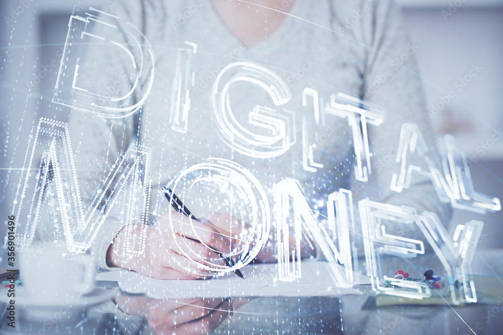 Cryptocurrency hologram over woman's hands writing background. Concept of blockchain. Multi exposure
