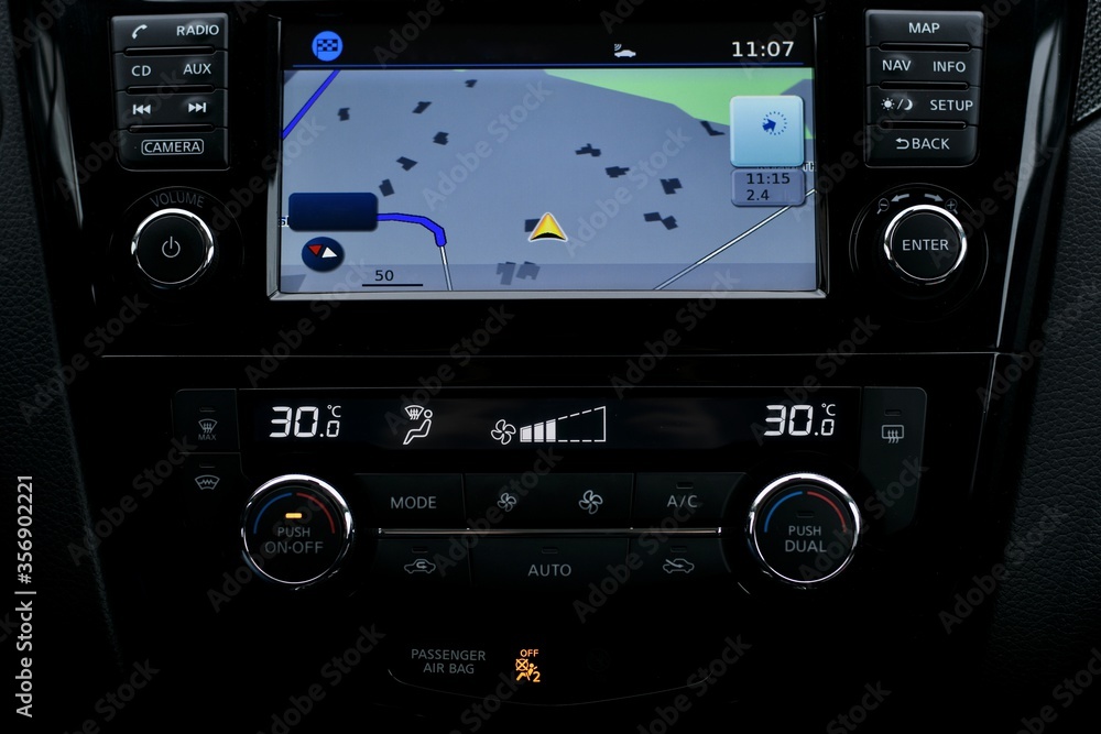 The car panel. A built computer screen with a navigator and a separate climate control zone.
