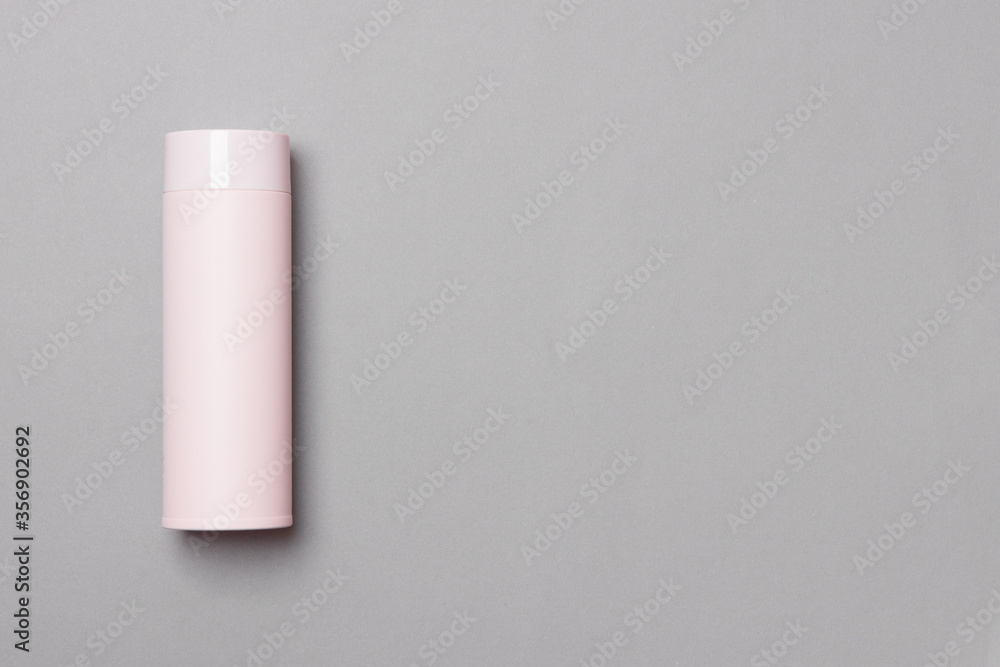 pink thermos cup on grey background with copy space pink thermos cup on grey background with copy space