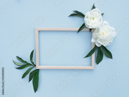 Flower arrangement of peonies. Spring, floral background. Frame with white flowers on a light background. The concept of spring. Mother's Day, Women's Day. Flat lay, space for text. View from above.