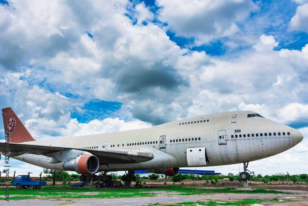 Nakhon Pathom, Thailand - June, 09, 2020 : The old commercial aircraft was discharged with a stormy sky at Nakhon Pathom, Thailand