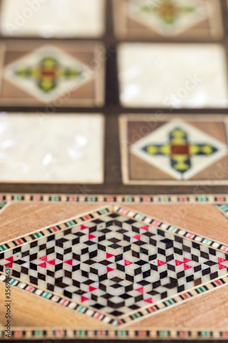фотографія Vertical close-up detail of delicate handcrafted fine wood trinket box, luxury m
