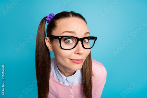 Close-up portrait of her she nice attractive pretty lovely cute funky curious cheery college girl looking at you isolated over bright vivid shine vibrant blue color background
