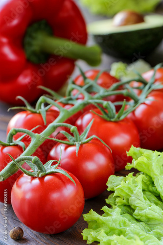 ripe, bright and juicy tomatoes on a twig
