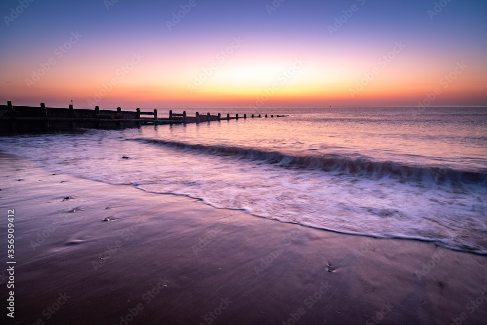 Hornsea Beach on the dramatic Yorkshire coast, fantastic adventure travel destination or holiday vacation to view picturesque scenery at sunrise or sunset

