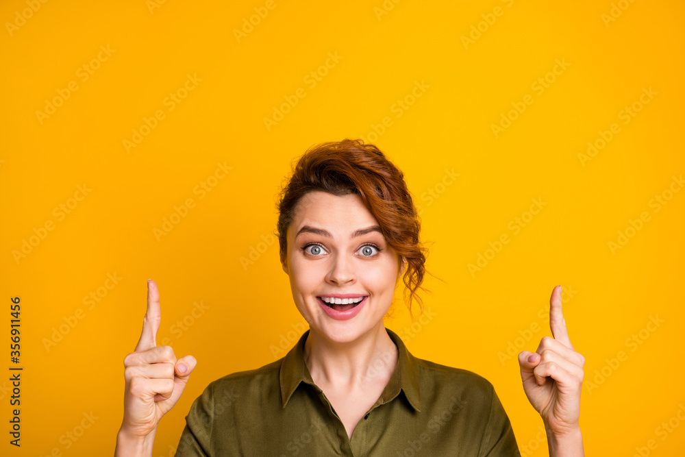 Close-up portrait of her she nice-looking attractive lovely glad cheerful cheery girl pointing two forefingers up copy space isolated over bright vivid shine vibrant yellow color background Close-up portrait of her she nice-looking attractive lovely glad cheerful cheery girl pointing two forefingers up copy space isolated over bright vivid shine vibrant yellow color background