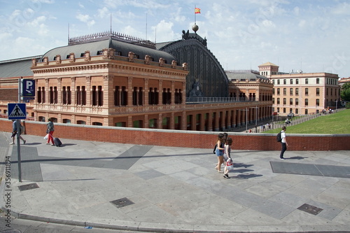 Unidentified people travel at Atocha train station in Madrid Spain