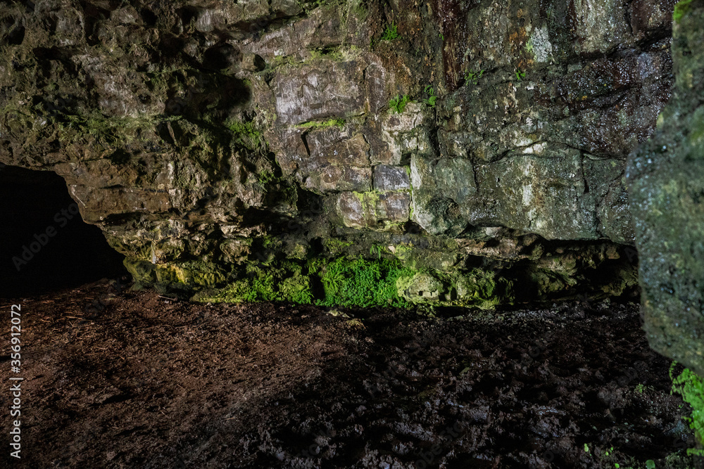 Stone wall in a cave, abstract nature background and texture.