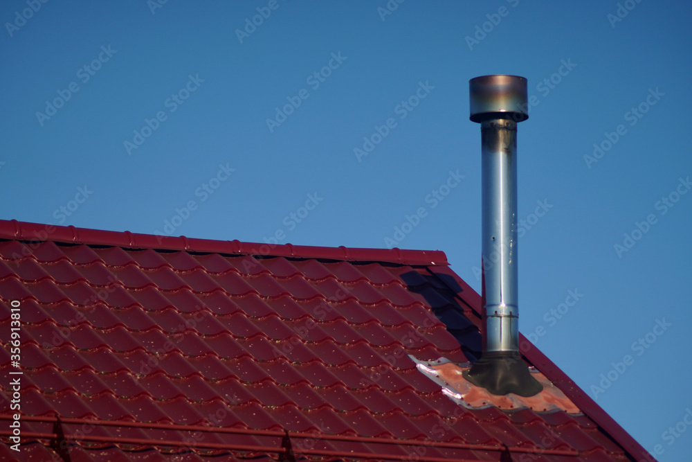 Roof of the house. Trumpet. Wood and roof tiles. Architecture. Texture. Buildings and structures. High quality photo