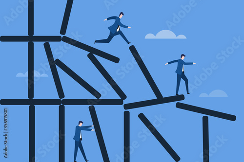 Business executives walking on a collapsing structure , Concept of meeting the challenges in business.