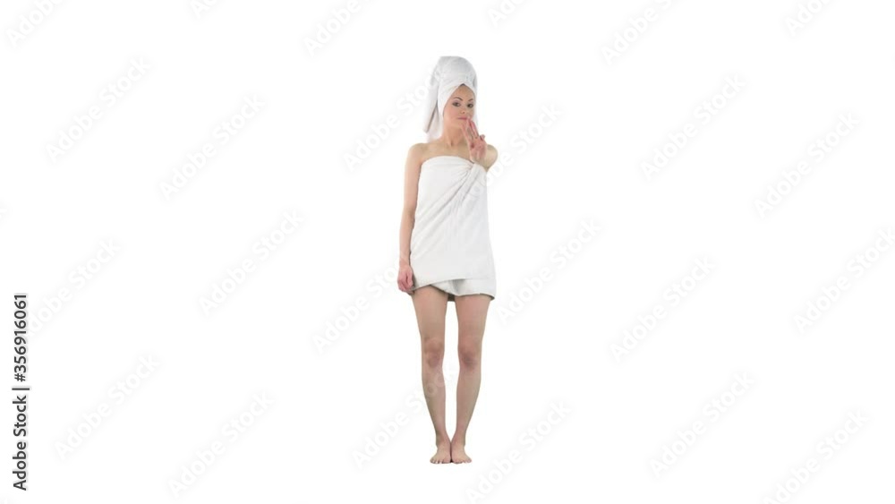Playful young woman counting to number five using fingers smiling and dancing isolated on solid white background. Playful young woman counting to number five using fingers smiling and dancing isolated on solid white background.