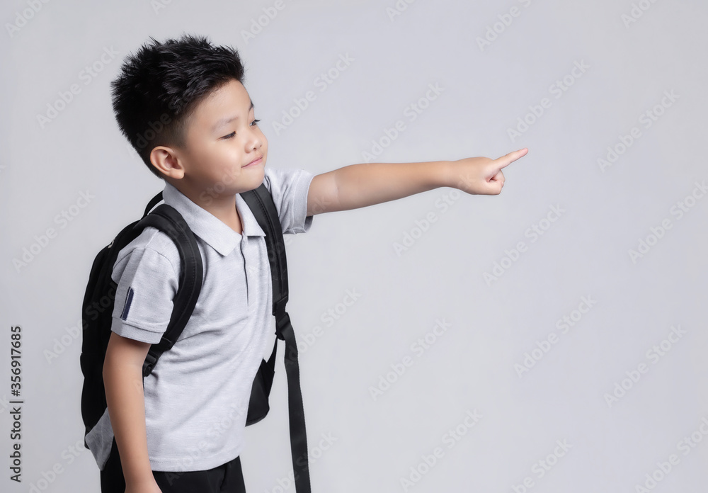 Smart little asian boy with backpack having fun. School concept. Back to School Smart little asian boy with backpack having fun. School concept. Back to School