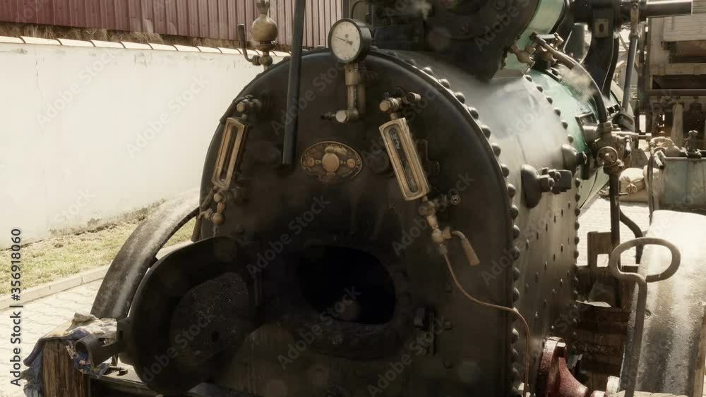 Boiler and Steam Engine Firebox / Steam Engine used as a drive to work threshers in agricultural work,in the late 19th and early 20th century Boiler and Steam Engine Firebox / Steam Engine used as a drive to work threshers in agricultural work,in the late 19th and early 20th century