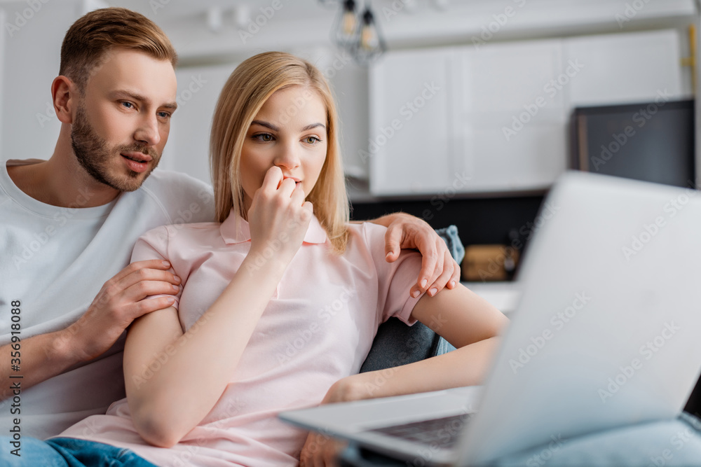 © LIGHTFIELD STUDIOS - selective focus of couple watching movie on laptop © LIGHTFIELD STUDIOS - selective focus of couple watching movie on laptop