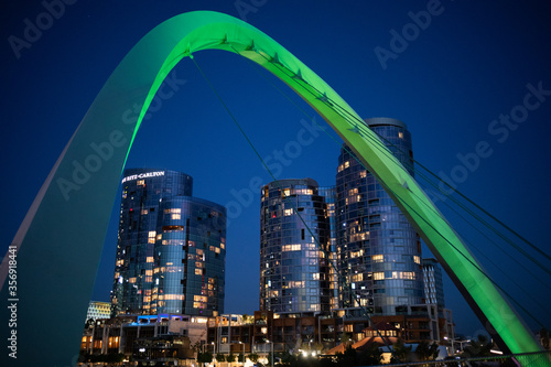 Perth, West Australia WA, Australia; February 2020: City skyline of the commercial business district CBD at night framed by illuminated arch