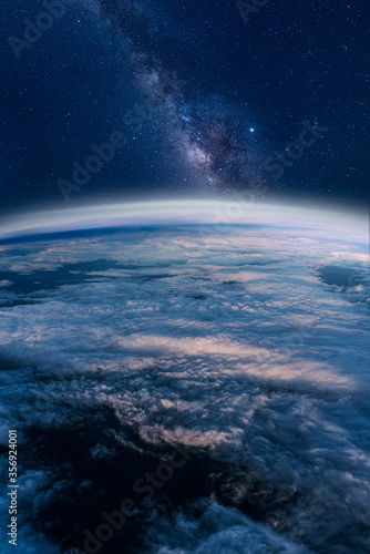 View of stars and milkyway above Earth from space © Alican