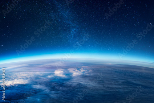 View of stars and milkyway above Earth from space
