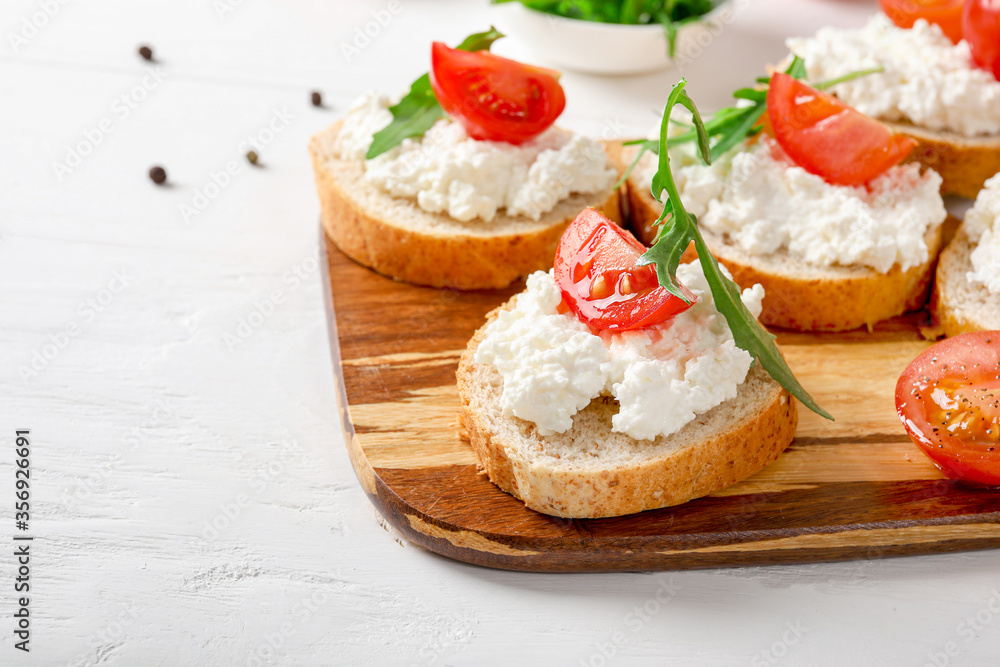 Healthy and tasty snack with bread, tomatoes and cottage cheese