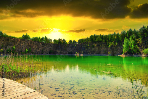 Fototapeta Naklejka Na Ścianę i Meble -  A turquoise lake on sunset. Travel and rest concept. Wonderful views and extraordinary places on earth, sunrise.