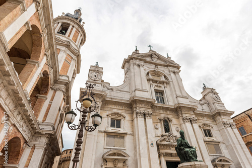 Italy, Loreto,perspective photo of the facade of the basilica of Loreto( In Italy), on the side a bell tower, cloudy sky background