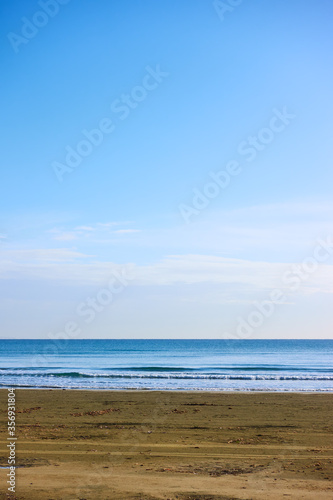 Sea, sandy beach and blue sky © Roman Sigaev