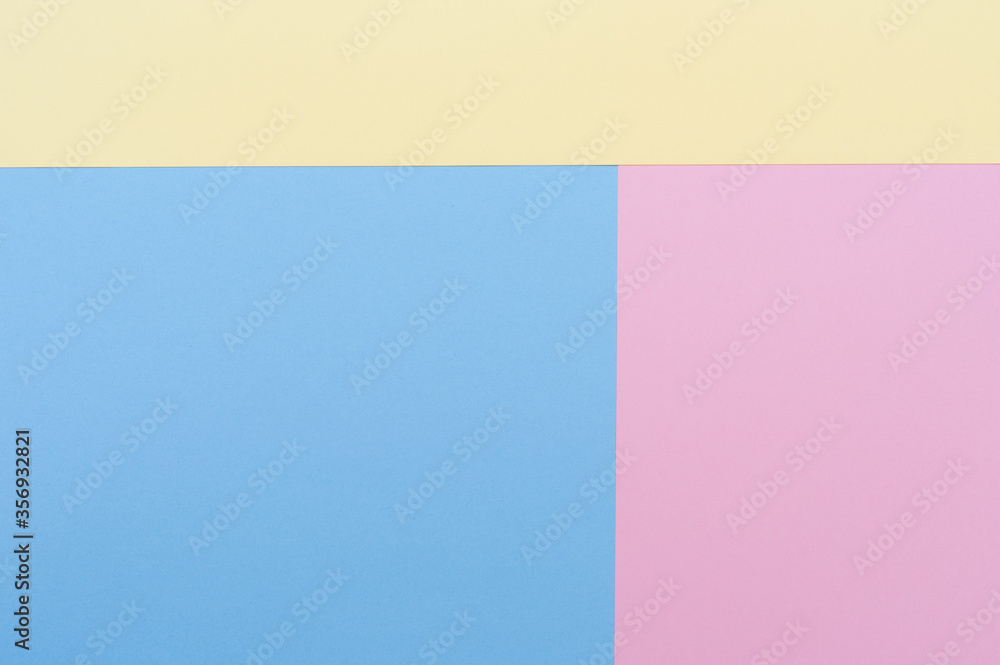 Yellow, blue and pastel pink background. Divided into three blocks. Backgrounds, textures.