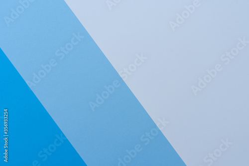 Background of different shades of blue. The colors cut through the image from top to bottom. Backgrounds  textures.