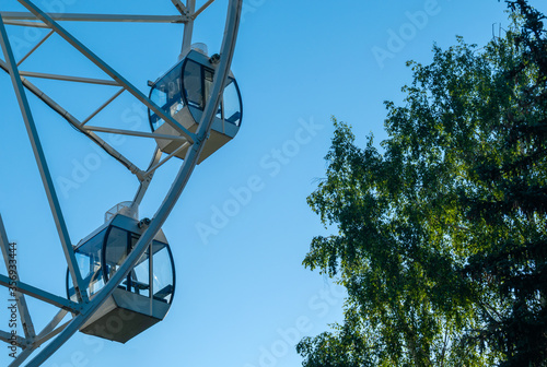 White Ferris wheel against the blue sky 3