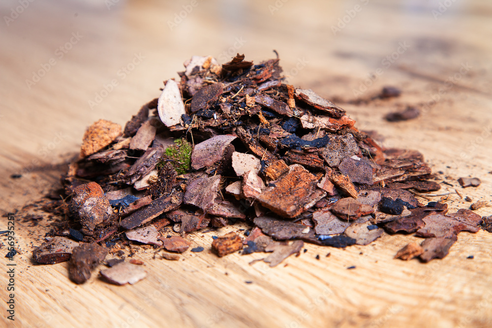 Dry pine bark for transplanting orchids of other plants. The substrate